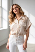 Beige blouse with gold foliage print